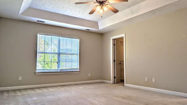 627 Surrey Ln, Martinez, GA 30907 - empty room featuring ceiling fan, carpet, a tray ceiling, visible vents, and baseboards