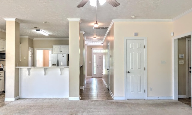 627 Surrey Ln, Martinez, GA 30907 - interior space with visible vents, baseboards, a textured ceiling, crown molding, and light colored carpet