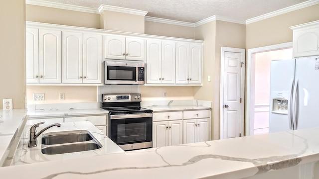 627 Surrey Ln, Martinez, GA 30907 - kitchen featuring a textured ceiling, a sink, white cabinetry, and stainless steel appliances