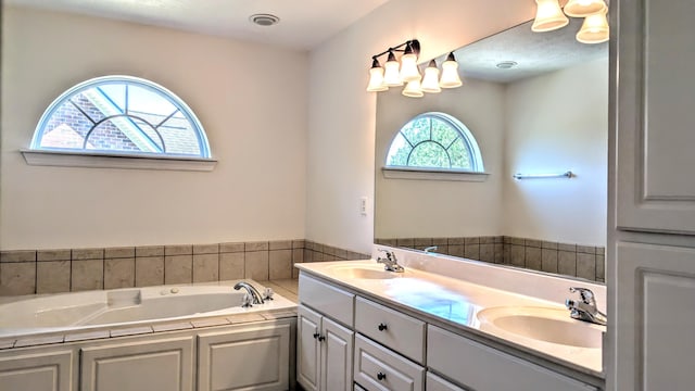 627 Surrey Ln, Martinez, GA 30907 - full bath featuring a garden tub, double vanity, and a sink