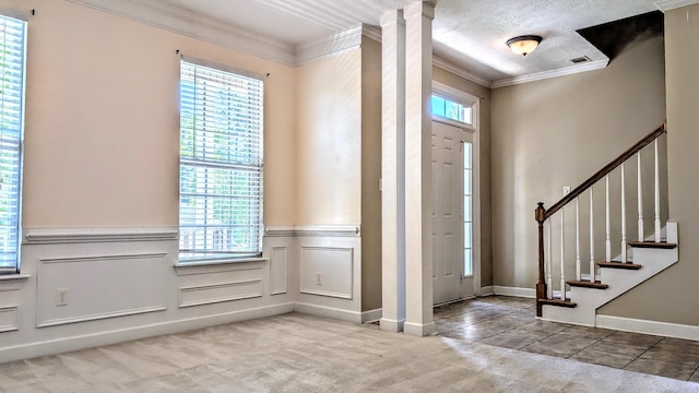 627 Surrey Ln, Martinez, GA 30907 - carpeted foyer with visible vents, ornamental molding, plenty of natural light, and stairway