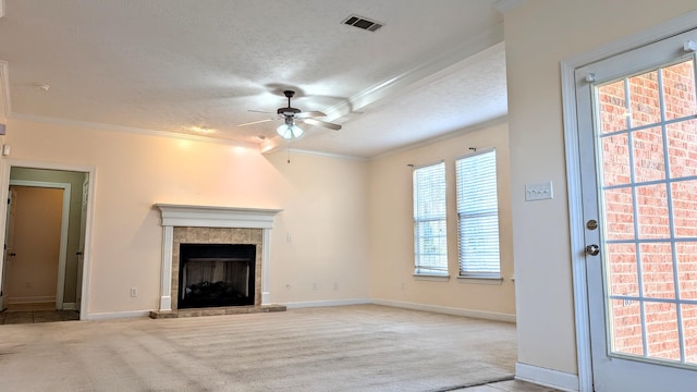 unfurnished living room featuring carpet floors, a textured ceiling, visible vents, and crown molding