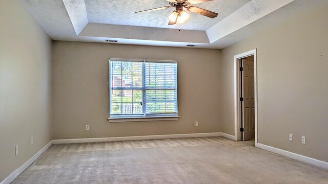627 Surrey Ln, Martinez, GA 30907 - unfurnished room with light carpet, a textured ceiling, baseboards, and a raised ceiling