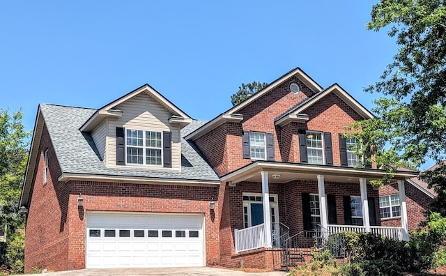 627 Surrey Ln, Martinez, GA 30907 - view of front of home featuring brick siding, a shingled roof, covered porch, and concrete driveway