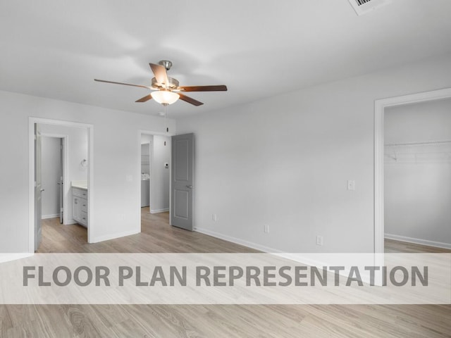 645 Hampton Dr Unit 5B, North Augusta, SC 29860 - unfurnished bedroom with baseboards, a spacious closet, wood finished floors, a closet, and ceiling fan