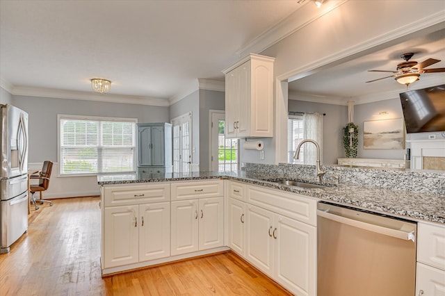210 Oleander Trl, Evans, GA 30809 - kitchen featuring stainless steel appliances, light wood-style flooring, a ceiling fan, stone countertops, and crown molding