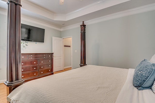210 Oleander Trl, Evans, GA 30809 - bedroom featuring wood finished floors, a raised ceiling, ornamental molding, and a ceiling fan