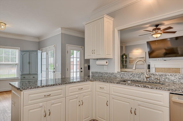 210 Oleander Trl, Evans, GA 30809 - kitchen with ceiling fan, stainless steel dishwasher, a peninsula, dark stone countertops, and white cabinets