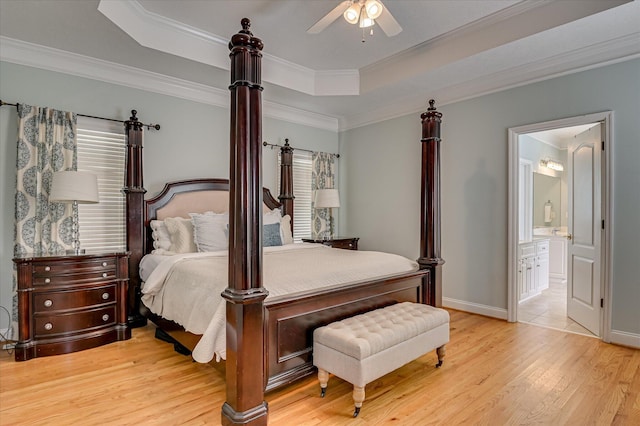 210 Oleander Trl, Evans, GA 30809 - bedroom featuring a raised ceiling, wood finished floors, crown molding, ensuite bathroom, and a ceiling fan