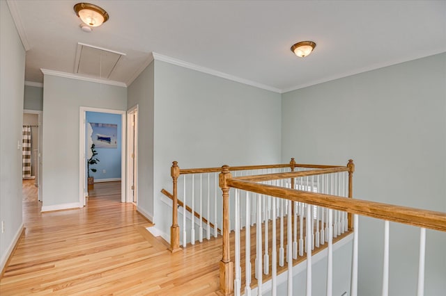 210 Oleander Trl, Evans, GA 30809 - hallway featuring attic access, an upstairs landing, wood finished floors, and crown molding