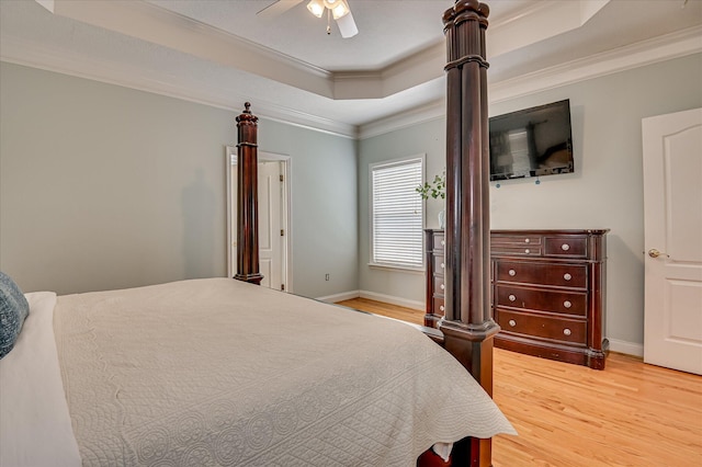 210 Oleander Trl, Evans, GA 30809 - bedroom featuring a tray ceiling, light wood-style flooring, crown molding, and ceiling fan