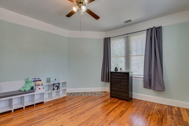 miscellaneous room featuring ceiling fan and light hardwood / wood-style floors