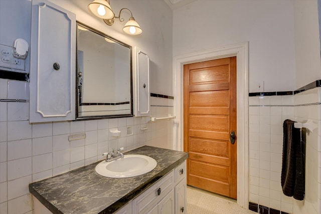 bathroom featuring tile patterned floors, vanity, and tile walls