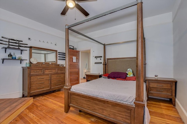 bedroom with ceiling fan and light wood-type flooring