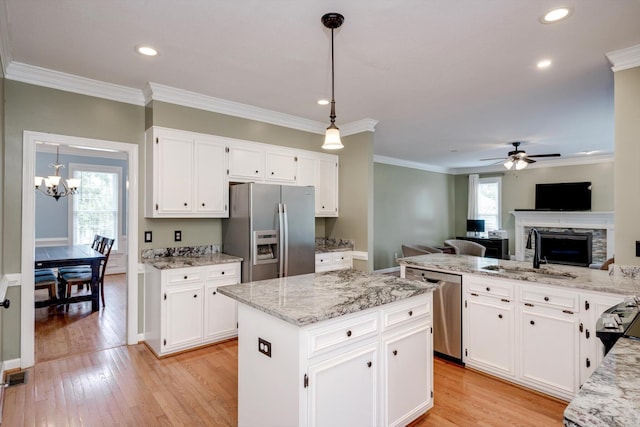 225 Old Mill Rd, Martinez, GA 30907 - kitchen with appliances with stainless steel finishes, a ceiling fan, recessed lighting, ornamental molding, and light stone counters