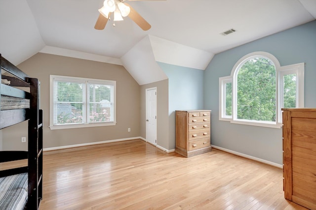 225 Old Mill Rd, Martinez, GA 30907 - unfurnished bedroom with light wood-type flooring, multiple windows, lofted ceiling, and ceiling fan