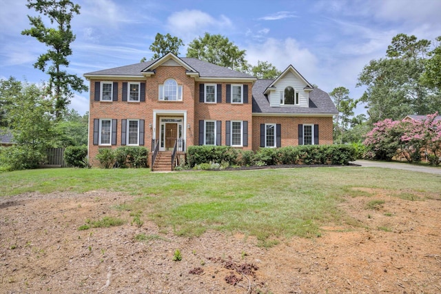 225 Old Mill Rd, Martinez, GA 30907 - colonial house with brick siding, a front yard, and a shingled roof