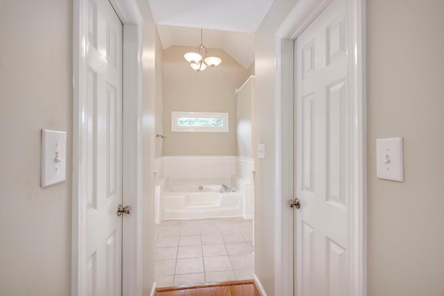 225 Old Mill Rd, Martinez, GA 30907 - hall featuring a chandelier, light tile patterned floors, and vaulted ceiling