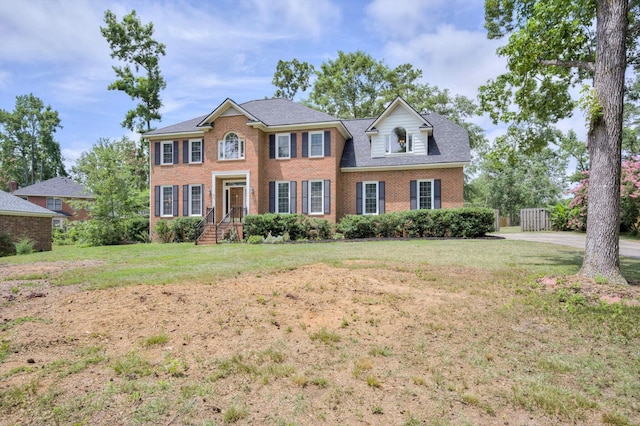225 Old Mill Rd, Martinez, GA 30907 - colonial-style house featuring brick siding and a front lawn