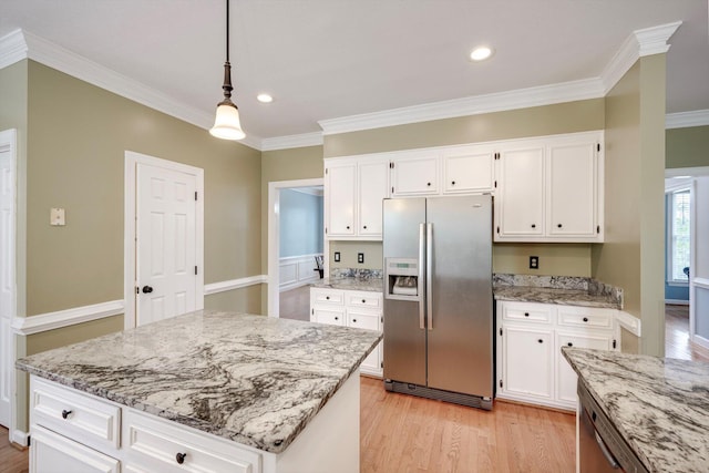 225 Old Mill Rd, Martinez, GA 30907 - kitchen with stainless steel fridge, light wood-style floors, white cabinetry, light stone counters, and pendant lighting