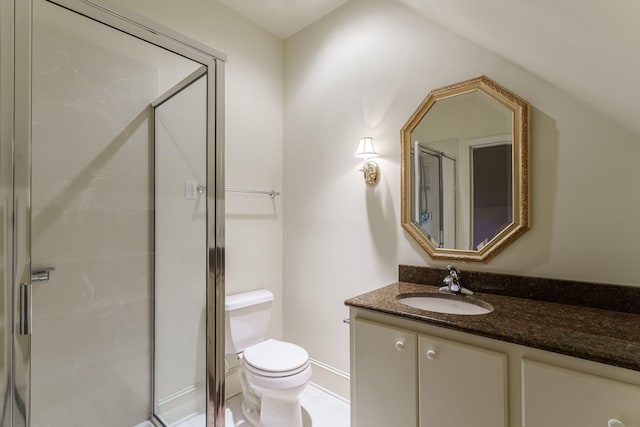 full bath with a shower stall, vanity, and toilet