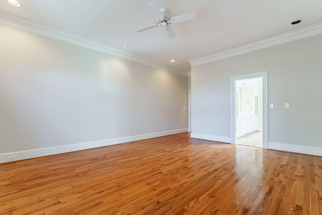 spare room with crown molding, recessed lighting, light wood-style floors, a ceiling fan, and baseboards