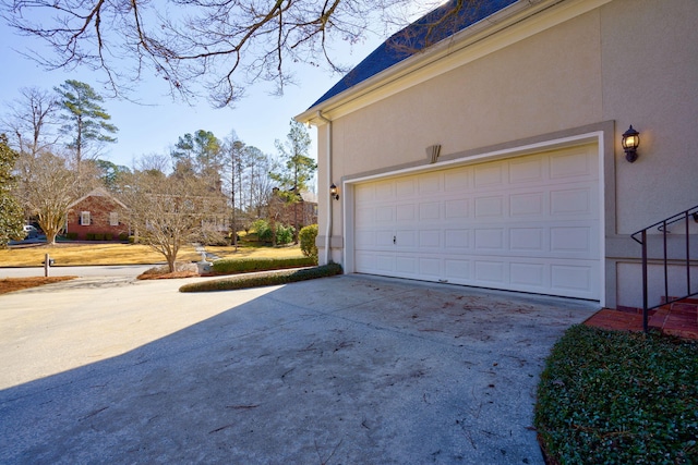 garage with concrete driveway