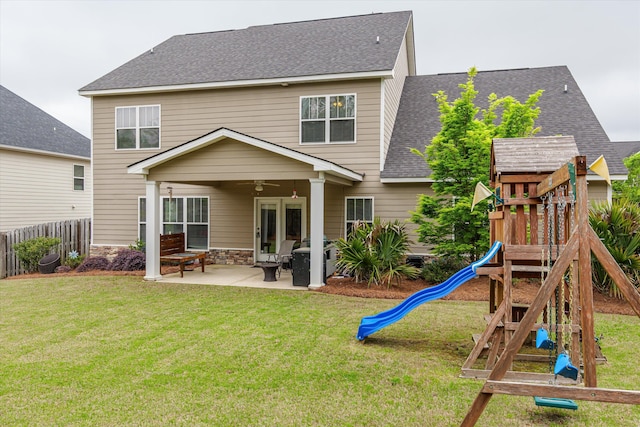 322 Pump House Rd, Evans, GA 30809 - back of property featuring a lawn, a patio, fence, a playground, and a shingled roof