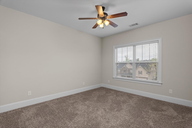 322 Pump House Rd, Evans, GA 30809 - unfurnished room featuring baseboards, dark colored carpet, a ceiling fan, and visible vents