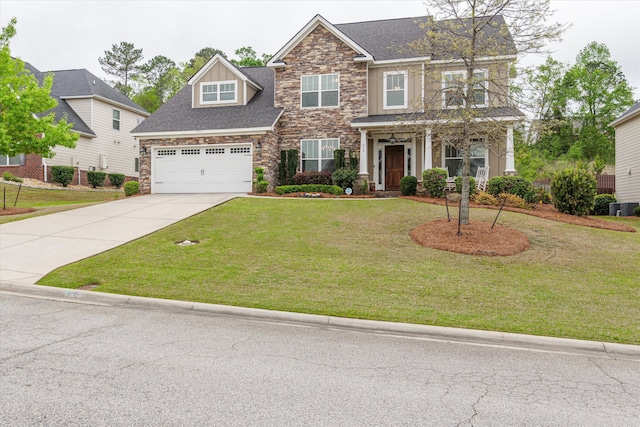 322 Pump House Rd, Evans, GA 30809 - view of front of home featuring a garage, a front yard, driveway, and stone siding