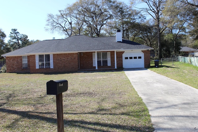 ranch-style house with brick siding, fence, and a front lawn