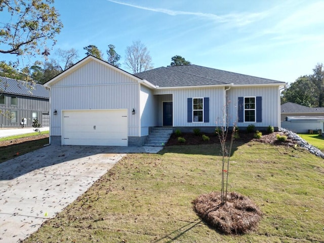 view of front facade featuring a front yard and a garage