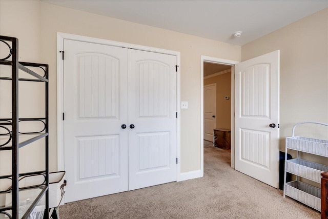 carpeted bedroom with a closet