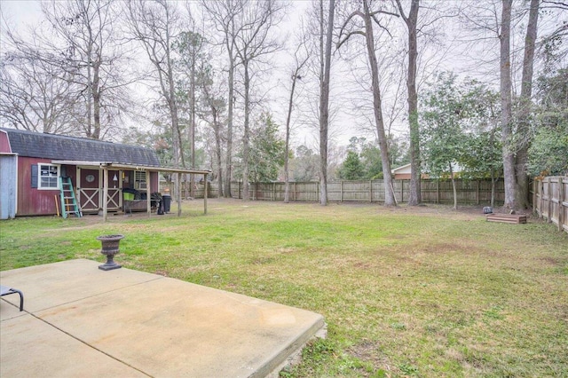 view of yard with a patio area and a shed