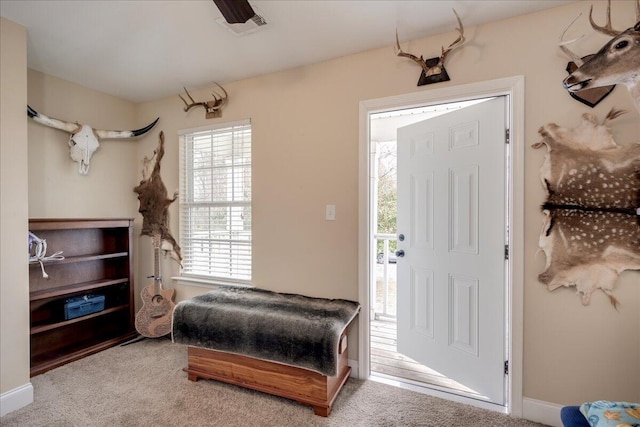 view of carpeted foyer