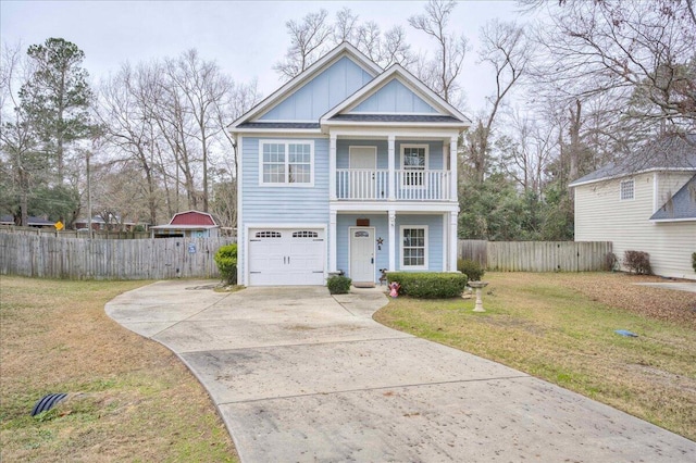 view of front facade featuring a balcony, a garage, and a front lawn