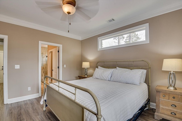 bedroom with baseboards, wood finished floors, visible vents, and crown molding