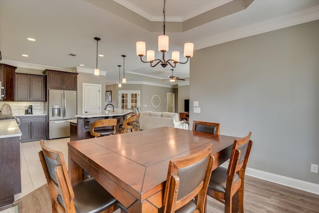 dining area featuring recessed lighting, ceiling fan with notable chandelier, visible vents, baseboards, and ornamental molding