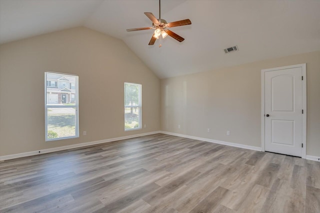 unfurnished room featuring ceiling fan, light hardwood / wood-style floors, and lofted ceiling