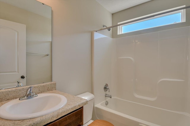 full bathroom with vanity, toilet, and tub / shower combination