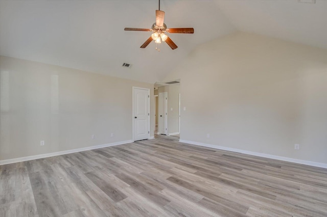 empty room with ceiling fan, high vaulted ceiling, and light hardwood / wood-style floors