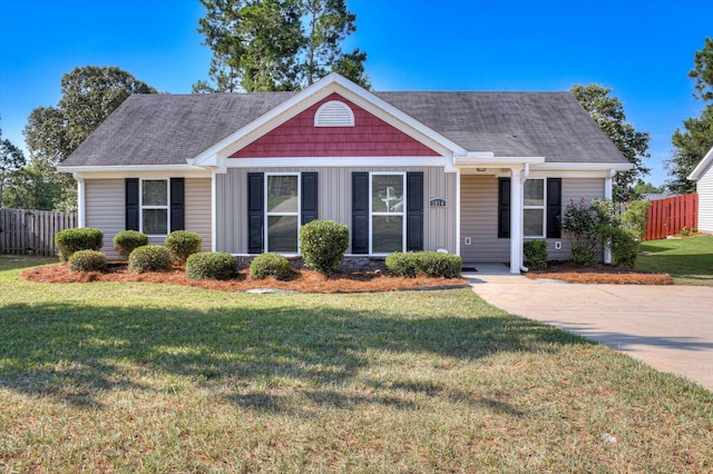 single story home featuring a front yard