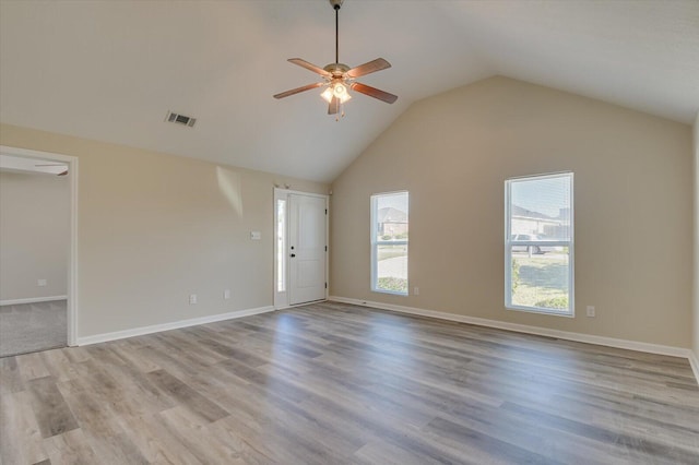 unfurnished living room featuring ceiling fan, high vaulted ceiling, and light hardwood / wood-style flooring