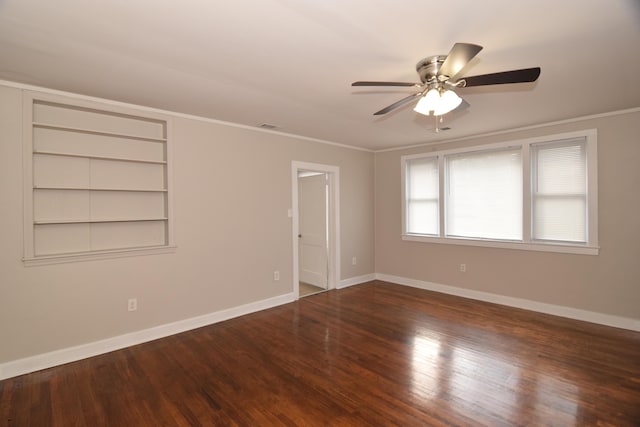 unfurnished room with built in shelves, ceiling fan, ornamental molding, and hardwood / wood-style flooring