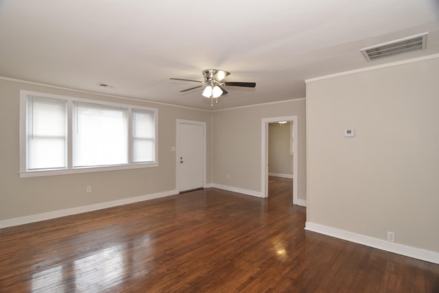 unfurnished room with ceiling fan, dark wood-type flooring, and ornamental molding