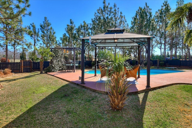 exterior space with a fenced in pool, a gazebo, and a patio