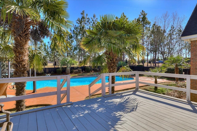 view of swimming pool with a wooden deck