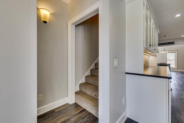 stairway featuring wood-type flooring