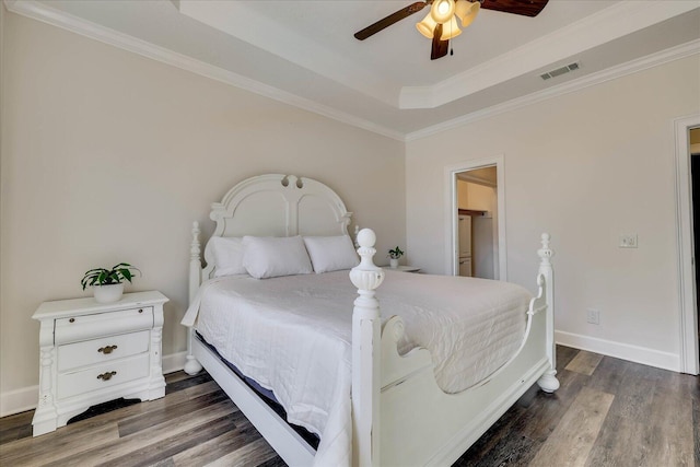 bedroom featuring a raised ceiling, crown molding, ceiling fan, and dark hardwood / wood-style flooring