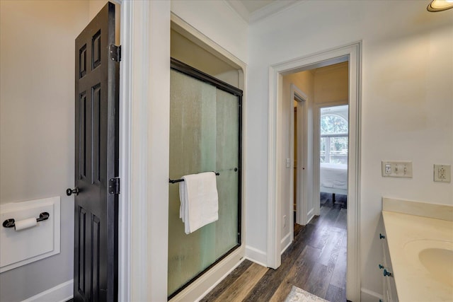 bathroom featuring vanity, hardwood / wood-style flooring, and walk in shower